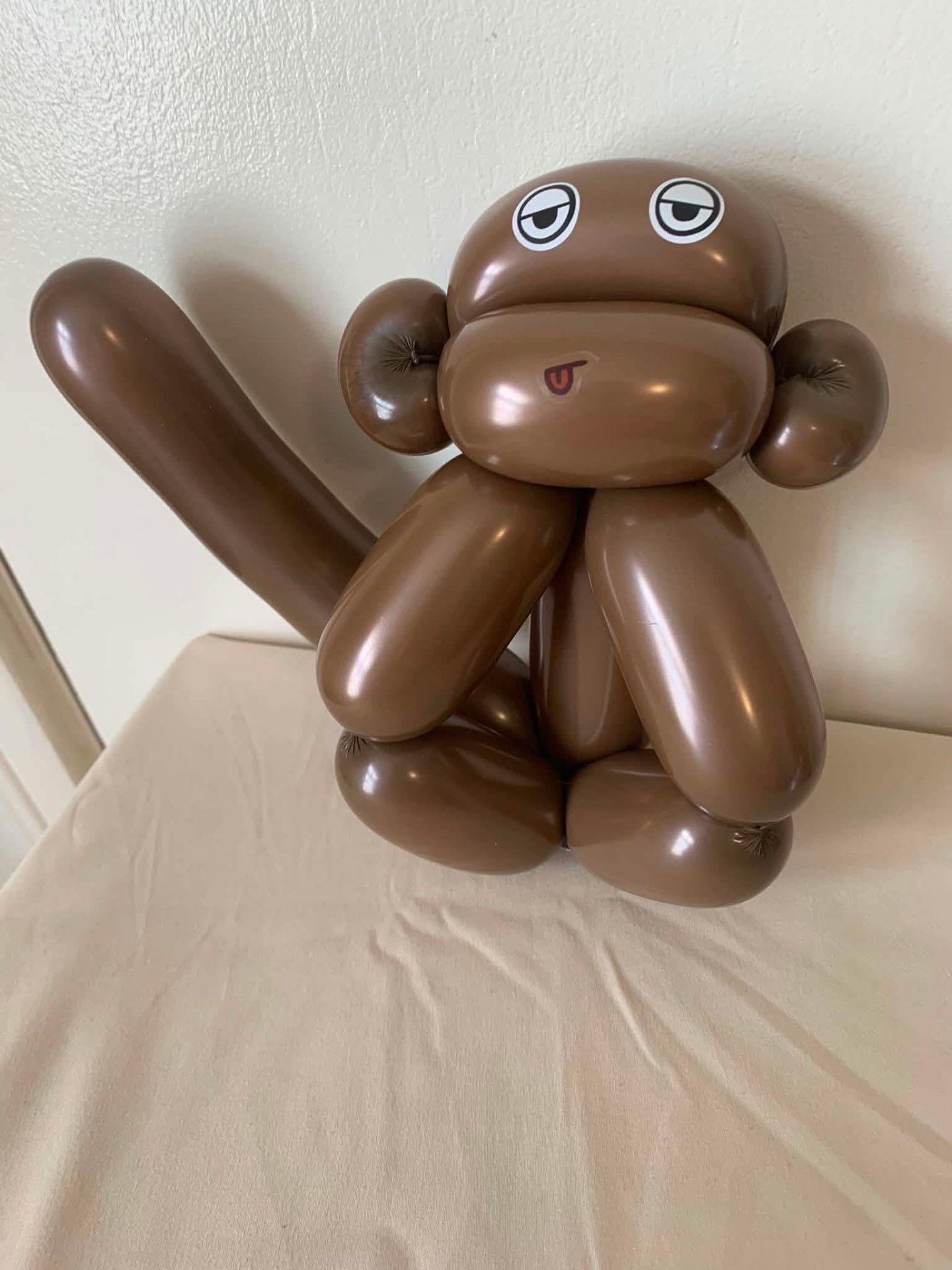 Brown balloon monkey sculpture